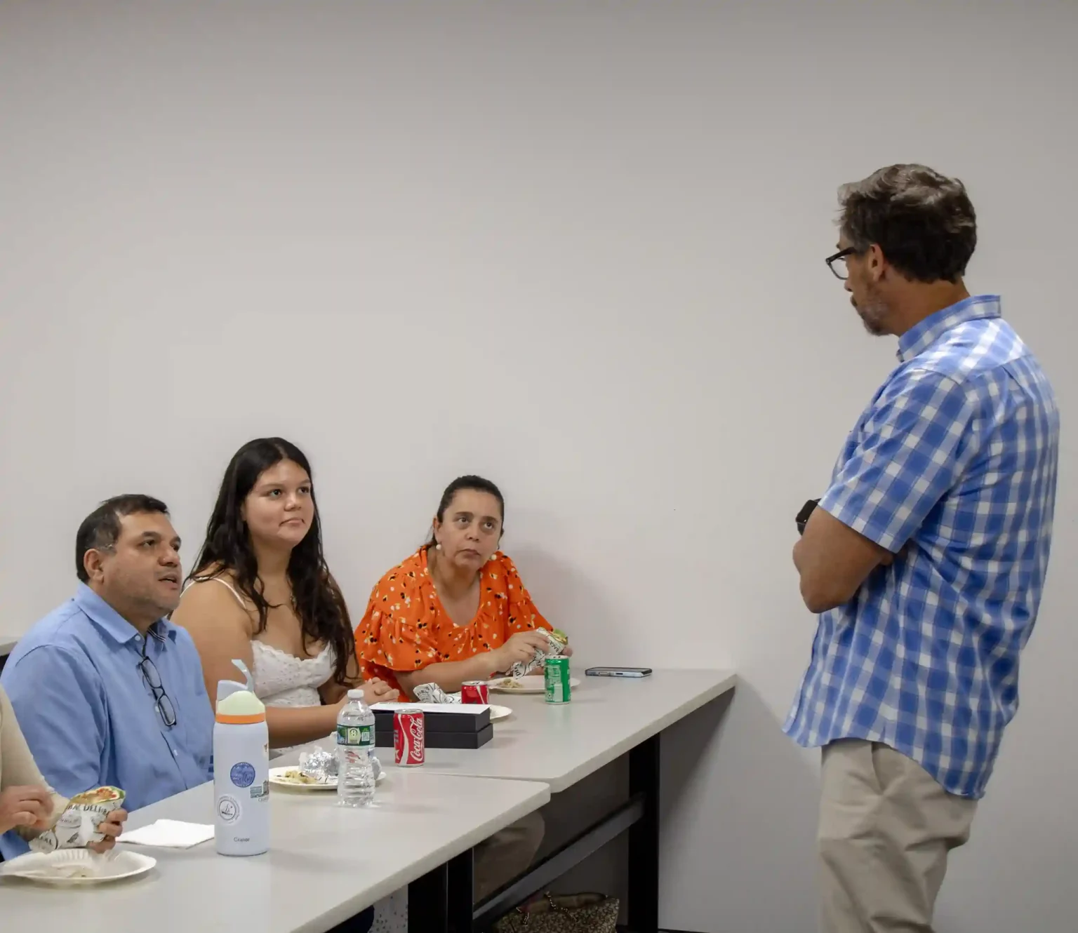 Paul K. Boyce talking to Elizabeth Estrada and family